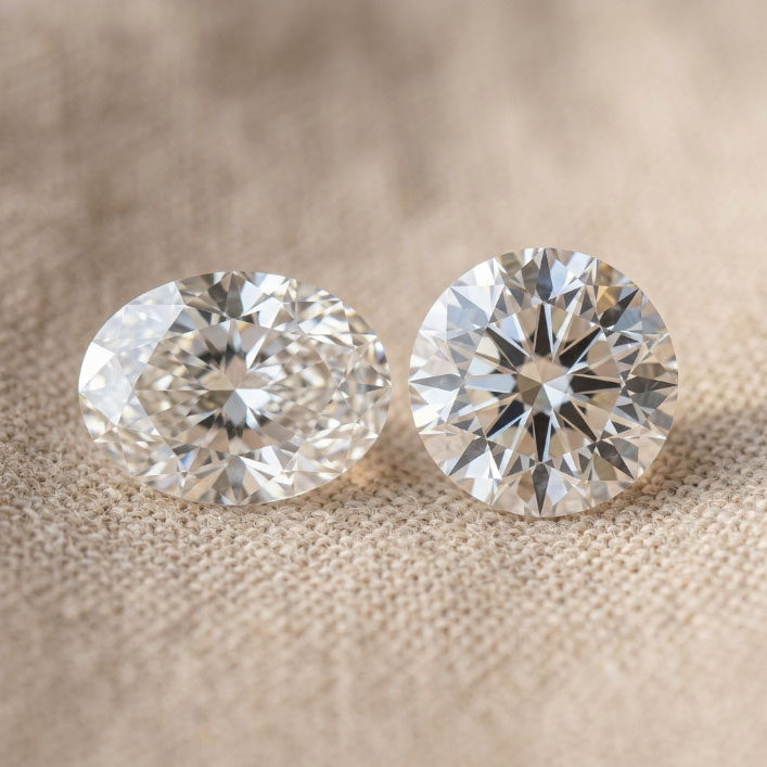 Oval and round lab grown diamonds compared for visible face-up size.