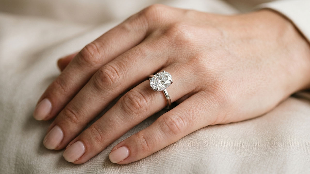 Oval lab-grown diamond engagement ring on hand with elegant elongated look