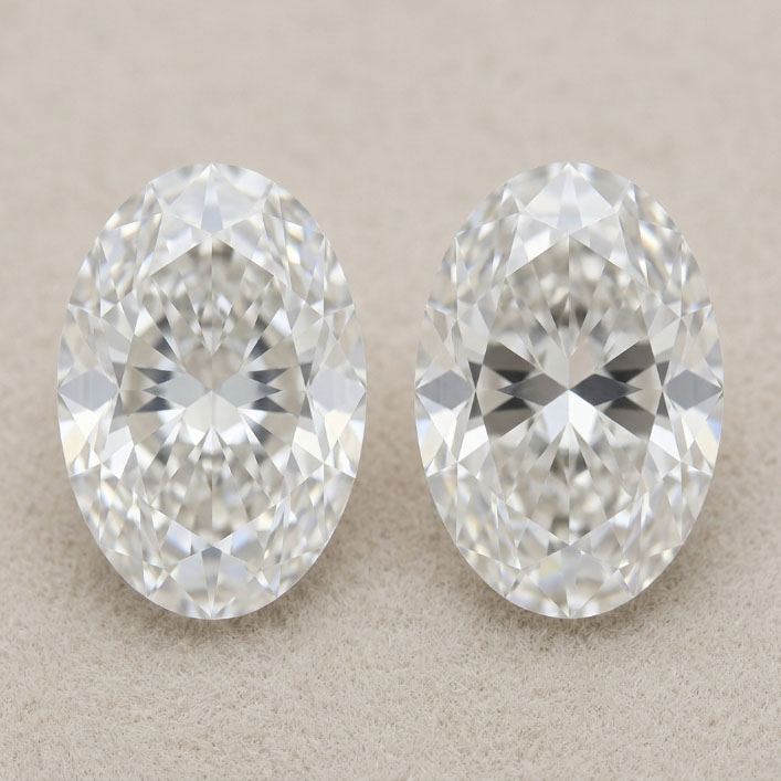 Two oval lab grown diamonds comparing mild and stronger bow-tie effect.