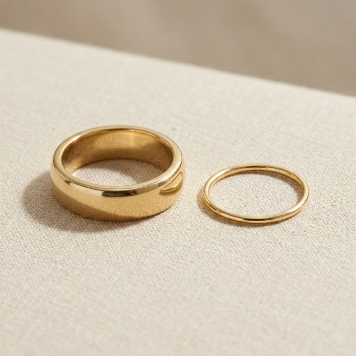 Solid 18K gold ring compared with gold plated jewelry sample.